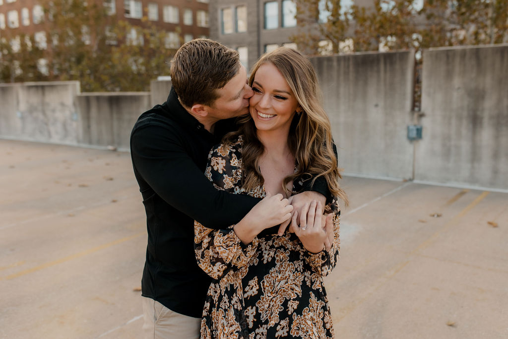 Engagement photo of couple embracing | Downtown Kansas City