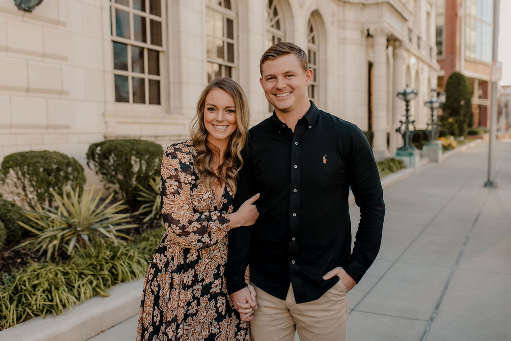 Fall Engagement Photo of Couple holding hands in downtown Kansas City