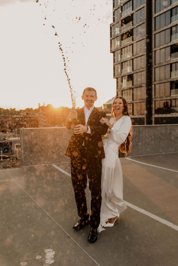 Couple Pops Champagne in Engagement Photo