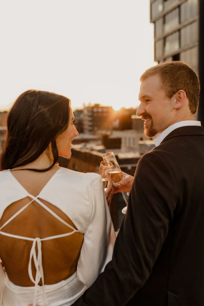 Couple cheers on rooftop